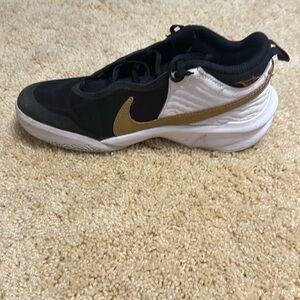 Nike blue, gold, and white basketball shoes